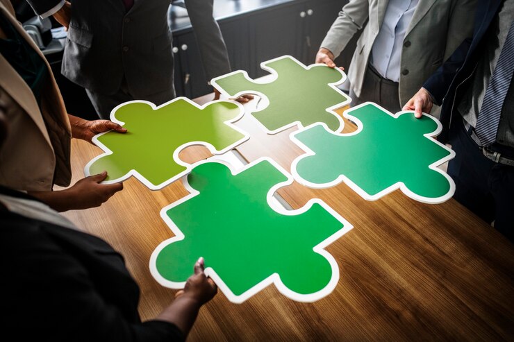business people connecting puzzle pieces